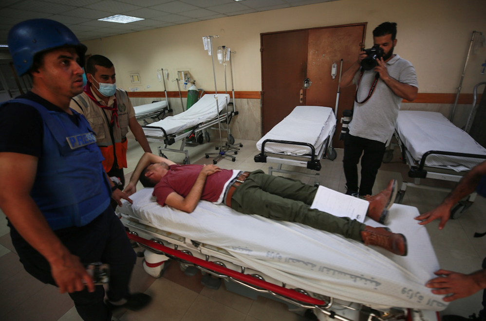 İsrail'in saldırılarında Anadolu Ajansı kameramanı yaralandı 15