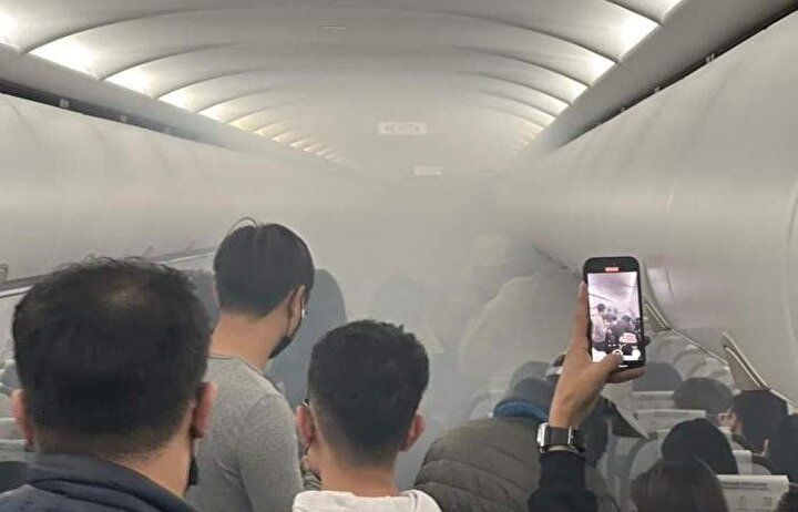 Uçakta korku dolu anlar: Şarj cihazı alev aldı, iki yolcu yaralandı 5
