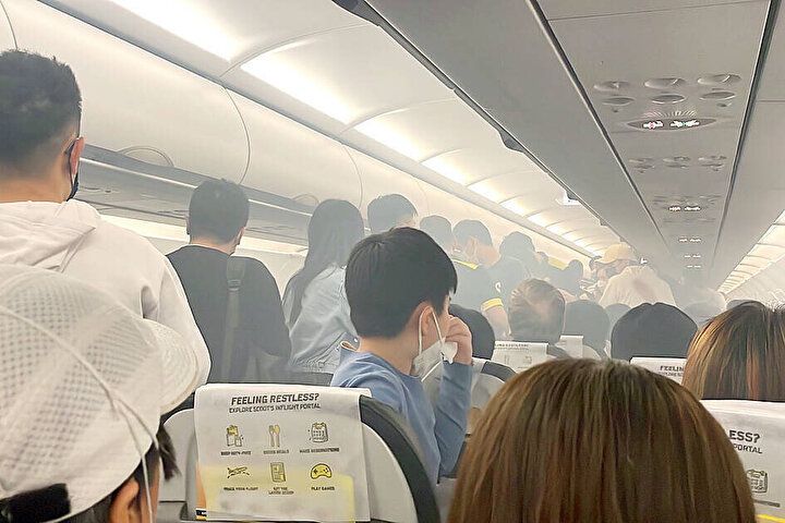 Uçakta korku dolu anlar: Şarj cihazı alev aldı, iki yolcu yaralandı 6