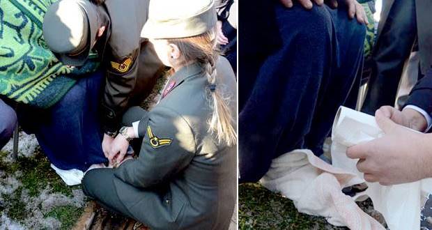 Askerler hemen yanına koşup ayaklarına kapandı