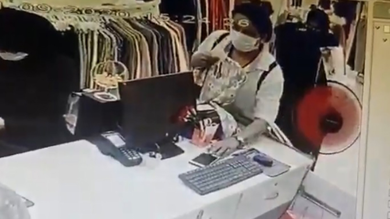 Mağazadaki kasiyerin cep telefonunu işte böyle çaldı