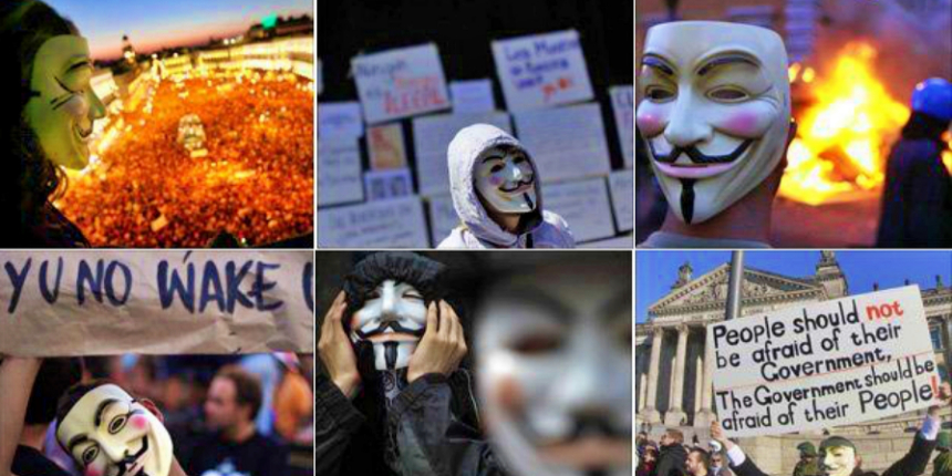 İngiltere'de maskeli protestocular başbakanın kuklalarını yaktı!