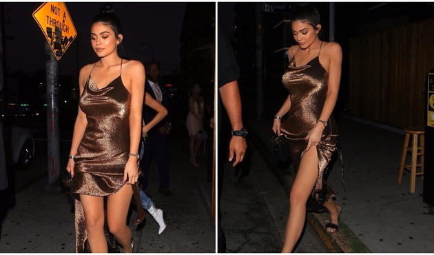 Kardashian'ların en küçüğü Kylie Jenner'in bronz elbisesi olay oldu!