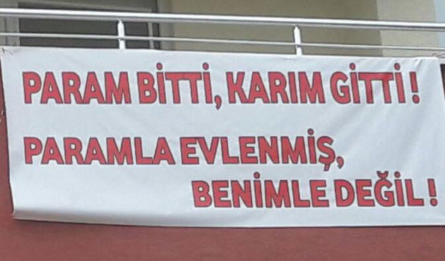 İhraç edilen polisten kendisini terk eden eşine pankartlı sitem!