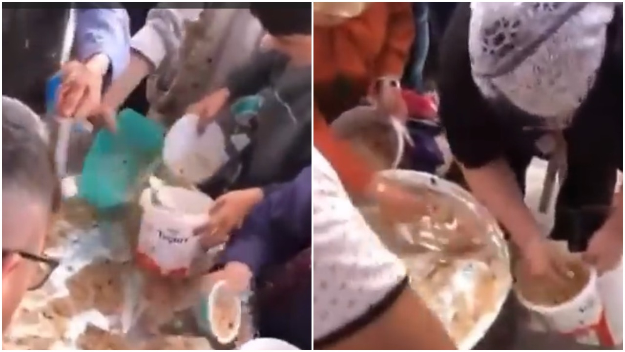 Aşure dağıtım etkinliğinde izdiham çıktı! Bir kadın elini kazana daldırdı