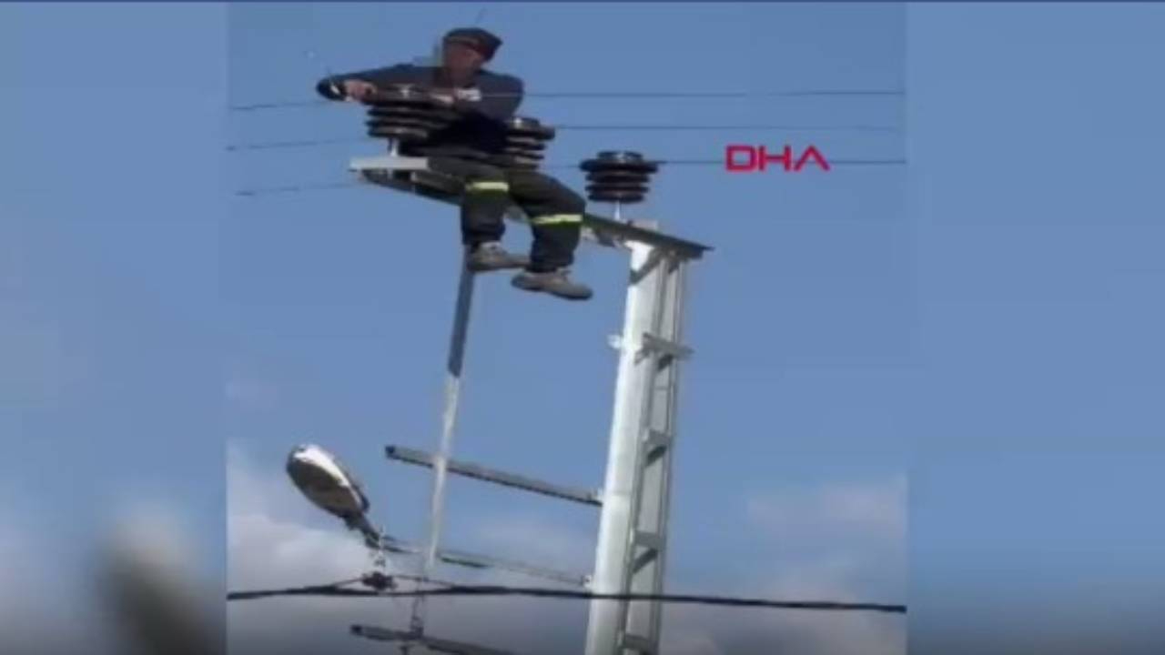Önlem almadan çıktığı elektrik direğinde tadilat yaptı