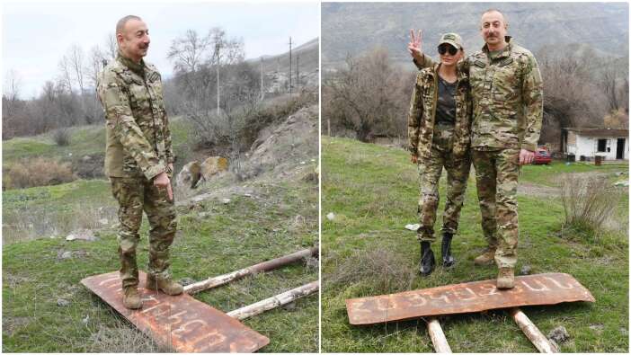 Ermenice tabelanın üzerinde zafer pozu