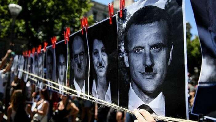 Macron'u Hitler'e benzeten afişlere soruşturma
